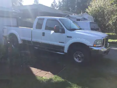Ford Lariat Super Duty 350 diesel 4x4 with extended cab and 8 foot Box. 4x4. Leather seats and box l...