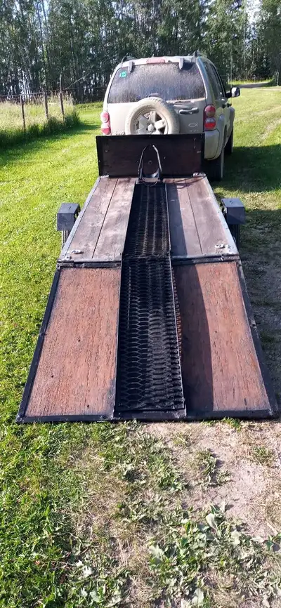 This motorcycle/snowmobile/utility trailer was built to haul my sport bike. It has new tires and rim...