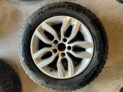 Used one season (less than 5,000 km) Hercules Avalanche RT 225/60/17 Snow tires on older BMW light a...
