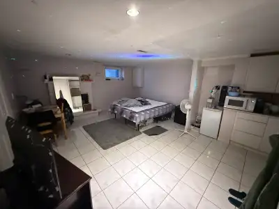 Spacious and fully furnished walk in studio basement apartment available for rent in a quiet, family...