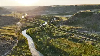 Private Riverfront Living – Exclusive Year Round Rental Site Near Drumheller This is not a campgroun...