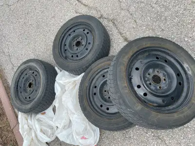 These are a set of four steel rims with 205/55R16 winter tires. They are used, but still have some l...