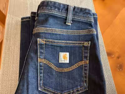 Ladies carhartt jeans like new size 2 asking 15.00