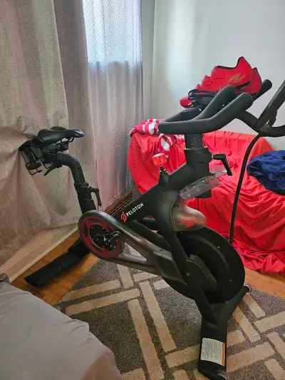 Get fit in your own home with this Peloton Bike, offering a smooth, high-quality cycling experience...
