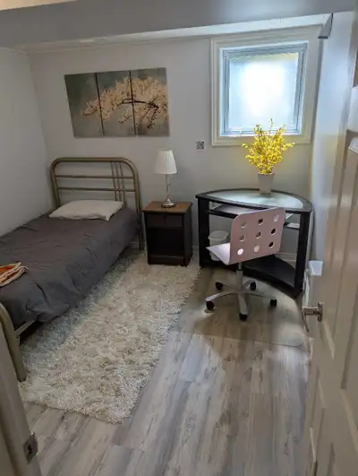 Private basement bedroom with full bathroom, kitchenette / living room / home theatre area for rent...