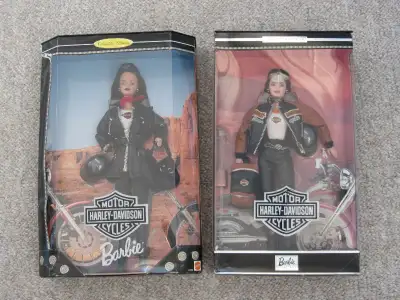 Two Harley Davidson barbie dolls (22256 & 25637). Neither doll has ever been removed from her box, b...