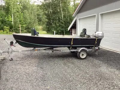 14’ boat(has a slight leak) on a 2020 Load Right trailer. Comes with 2 back rest seats, a pair of oa...