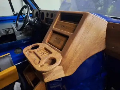 Selling an oak dash kit for 70's to mid 90's fullsize Chevy vans. Made for vans with heat/Ac vents....
