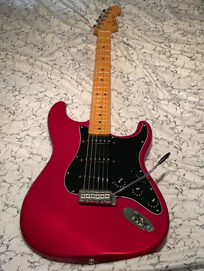 2002 Metallic Red Stratocaster. Maple neck 21 frets, plays well, good condition sold as is. $650 fir...