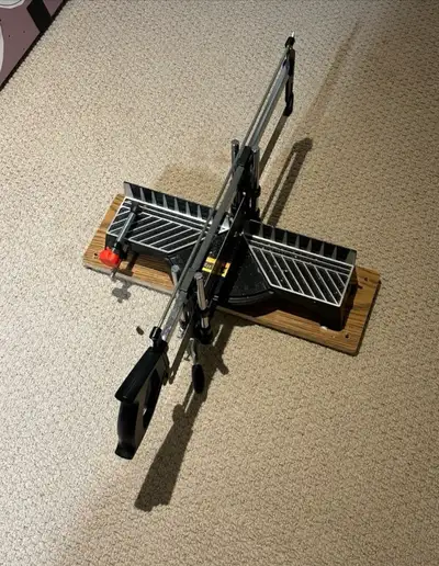 This Empire precision manual miter saw is perfect for accurate cuts in woodworking projects; while i...