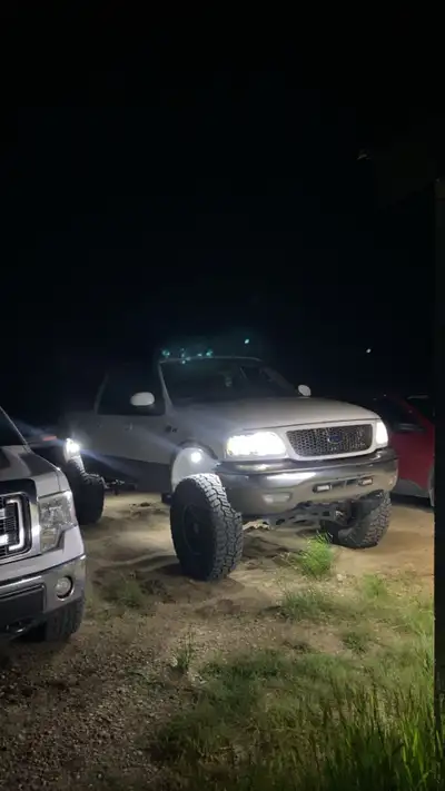 2003 f150 runs and drives good king ranch with front and rear captain seats, moon roof, 4-6 inch sof...