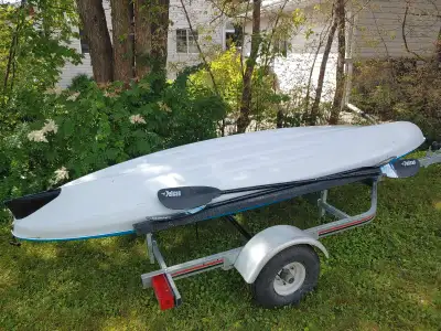 13.5' Pelican double kayak with 2 paddles. No trailer I just use it to keep it off the ground. Used...