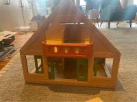 Plan Toys Wooden Dollhouse, 8 dolls and furniture