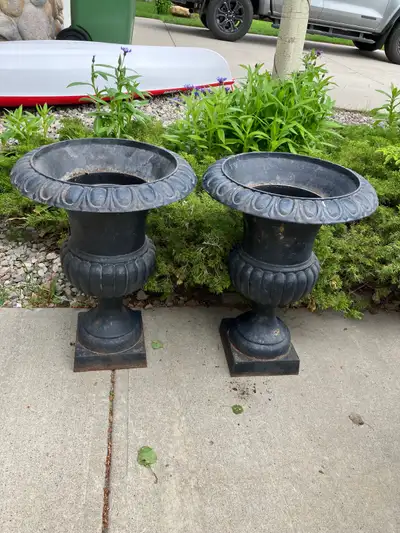 Set of 2 cast iron black urn planters. 30” tall, selling as a set. Very heavy and needs a fresh coat...