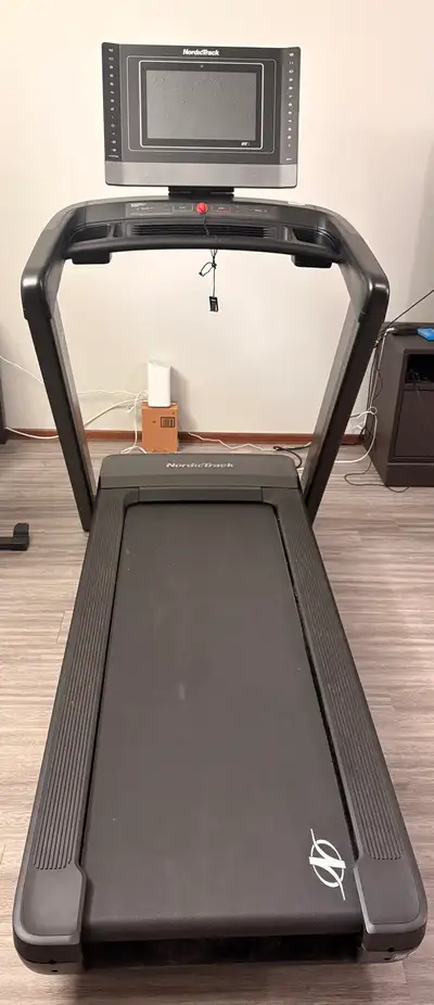 I'm selling a NordicTrack Commercial 1750 treadmill that's designed for serious runners and fitness...