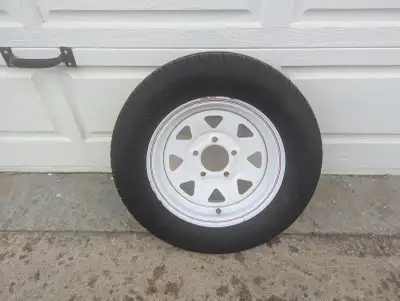 Kenda 13" trailer tire Model: ST175 80 D13 load cap. 1360 5 bolt on 4 1/2 spoked rim purchased new,...