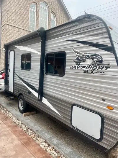 RV (Recreational Vehicle) Color: Gray Brand Name: Jayco JayFlight SLX Size: 22 feet long bumper-to-b...