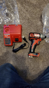 Milwaukee 1/4" hex impact drive with charger
