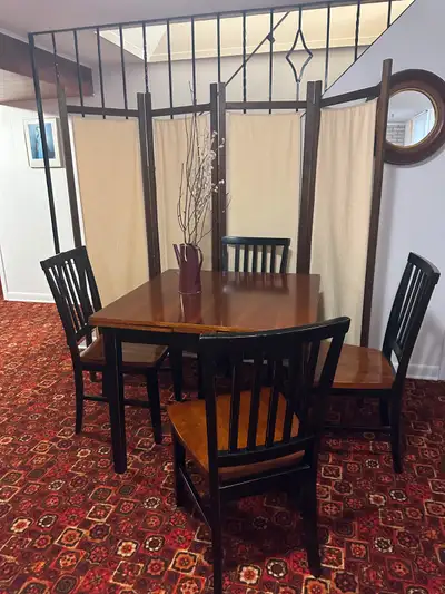Contemporary dining room set with 6 chairs. Table measures 36x36, when extended with side leaf on ea...