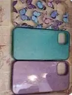 These three pre-owned protective cases offer reliable coverage for your iPhone, featuring one butter...