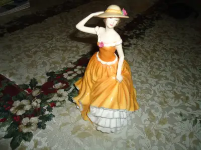 ROYAL DOULTON FIGURINE, BRAND NEW, still in the original box. YELLOW COLOUR, her name is Patricia. I...