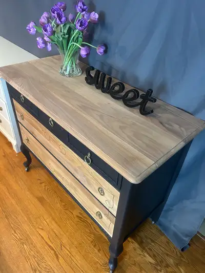 This refinished antique dresser features a stunning wood top, complemented by a sleek charcle gray b...