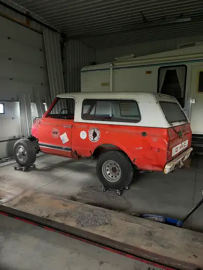 This 1972 GMC Jimmy is a classic project vehicle that is currently in a disassembled, restoration-re...