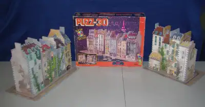 1992 edition of the Wrebbit PUZZ-3D puzzle: Paris 1859 Quai de Megisserie. Puzzle is the combination...