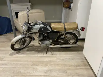 Vintage Yamaha motorcycle not working. Comes with key. It features a 100cc two-stroke twin engine. I...