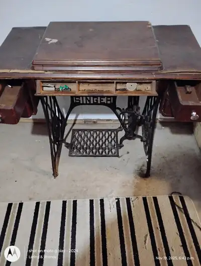 Old Singer sewing machine & desk needs work cheap, View more