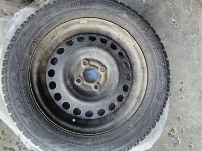4 winter tires good tread on 4 stud rims. 185/65 R15 88T