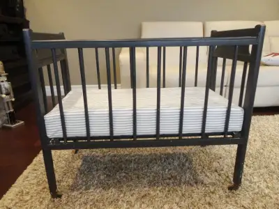 Antique 1930's to 1940's Wooden Baby Crib with Wooden Caster Wheels with Mattress in excellent shape...