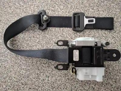 I have a Driver's Front Seat Belt Pretensioner (fits inside the Driver's side door) from a 2005 Mazd...