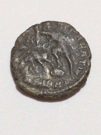 Ancient Roman coin, Hungary-found, soldier spearing Barbarian