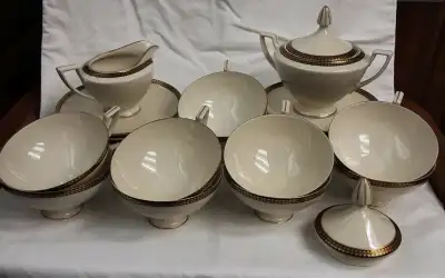 Egyptian Revival. Antique. 10 cups: 2"h, 4.5"w mouth, 5.5" wide overall. 10 saucers: 6.5" wide. 1 sp...
