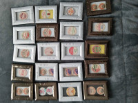 20 picture frames with old cardboard milk bottle caps in them