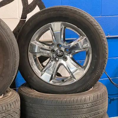 Set of four 235/60/18 Bridgestone all season tires mounted on aluminum rims 18" 5x114.3 +40 67.1 Tir...