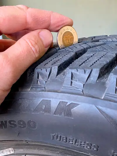 For sale - set of four Bridgestone Blizzak winter tires only used for half a season with lots of tre...