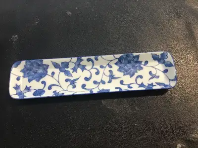 In excellent condition, this cobalt blue dish measures 9.25 inches long, , 2.25 wide. Made in Japan....