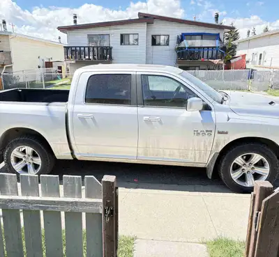 2013 Dodge Ram Truck. Front bumper damaged, back left light damaged. Left back door dented. Fuel doo...