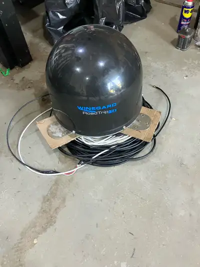 The Winegard RoadTrip T4 is a compact, automatic, in-motion RV satellite antenna that lets you watch...