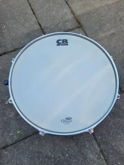 Chrome-plated CB Drums 12" snare drum with a metal shell. Has a standard throw-off mechanism, but no...