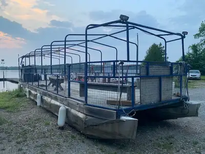 36 Foot Pontoon Boat with 90HP 4 stroke Mercury motor. Some dents in the stainless steel pontoons bu...