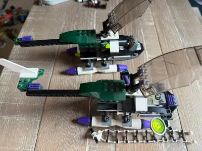 Two Joker's helicopters from the classic retired 2006 LEGO Batman set 7782 ("The Batwing: The Joker'...