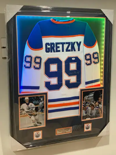 Capture a piece of hockey history with this authentic Edmonton Oilers jersey, autographed by the leg...