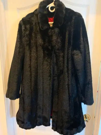 Large black fur coat, excellent conditions and looks like new., View more