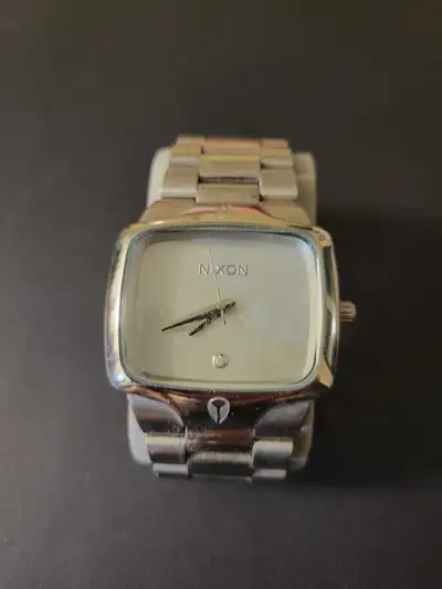 Nixon The Small Player watch in silver-tone stainless steel with a diamond accent at the 6 o'clock p...