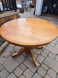 Antique round wooden table with leaf