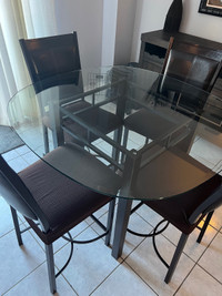 Glass table + 4 chairs 