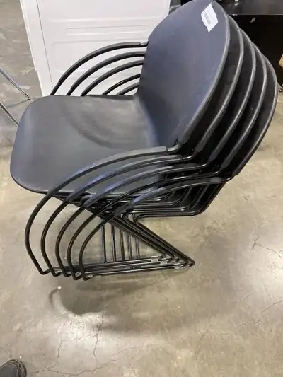5 BLACK PLASTIC STACKING CHAIRS, View more